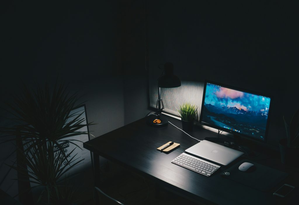 clean minimal desk with monitor and keyboard for distraction-free home office setup