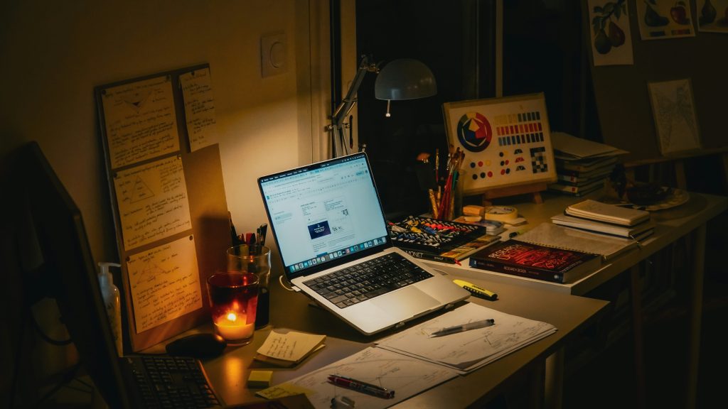 avoid burnout working from home late night desk with candle