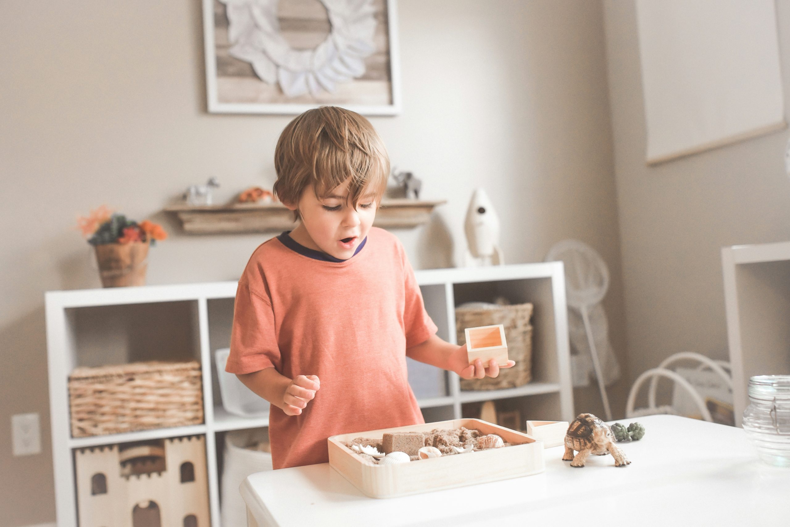 child playing independently while parent works from home with kids