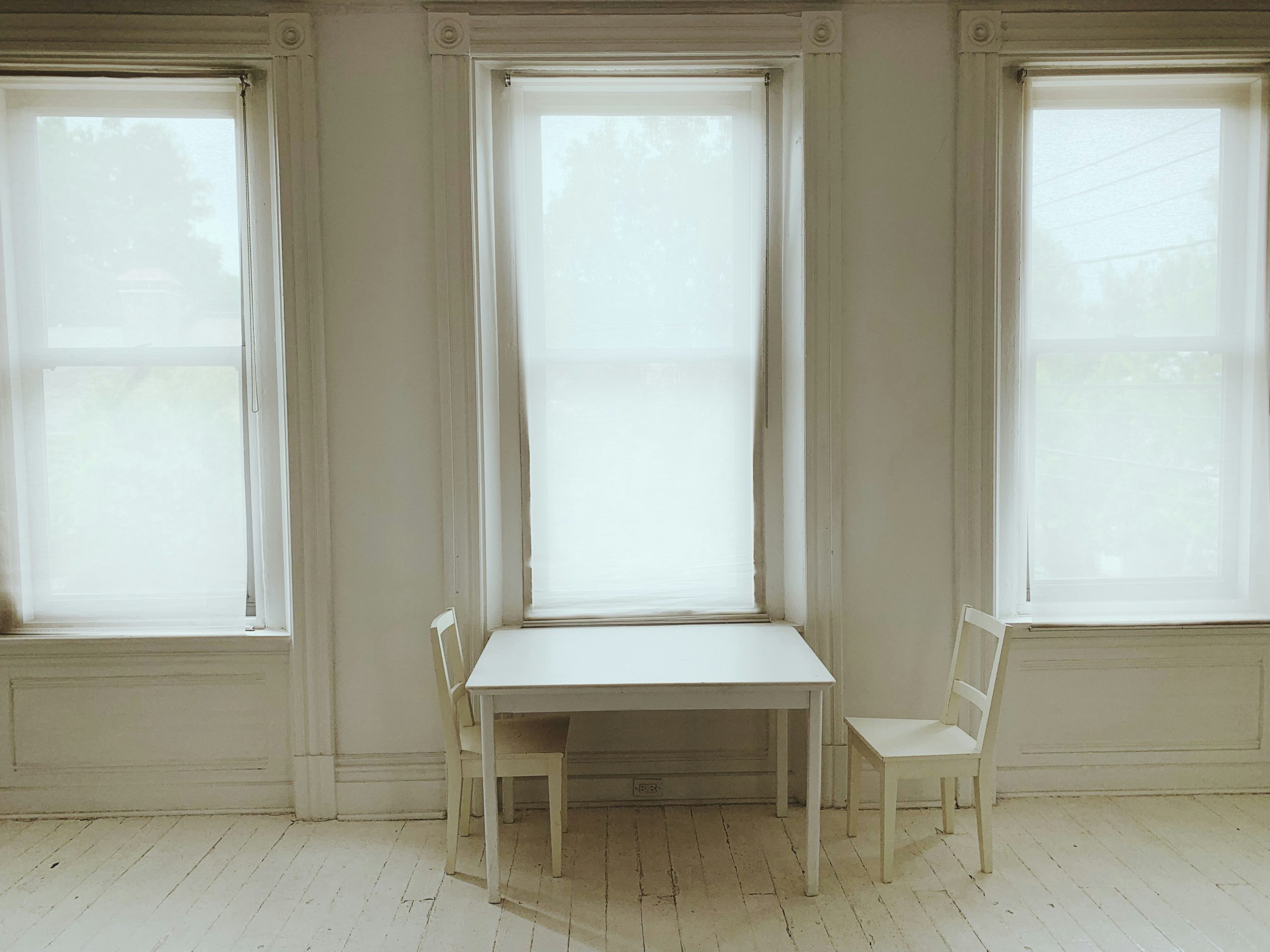empty peaceful room with white chairs for monk mode productivity