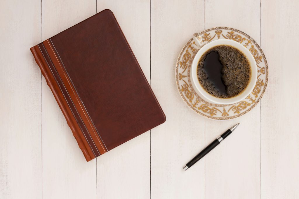morning routine for remote workers journal and coffee on desk