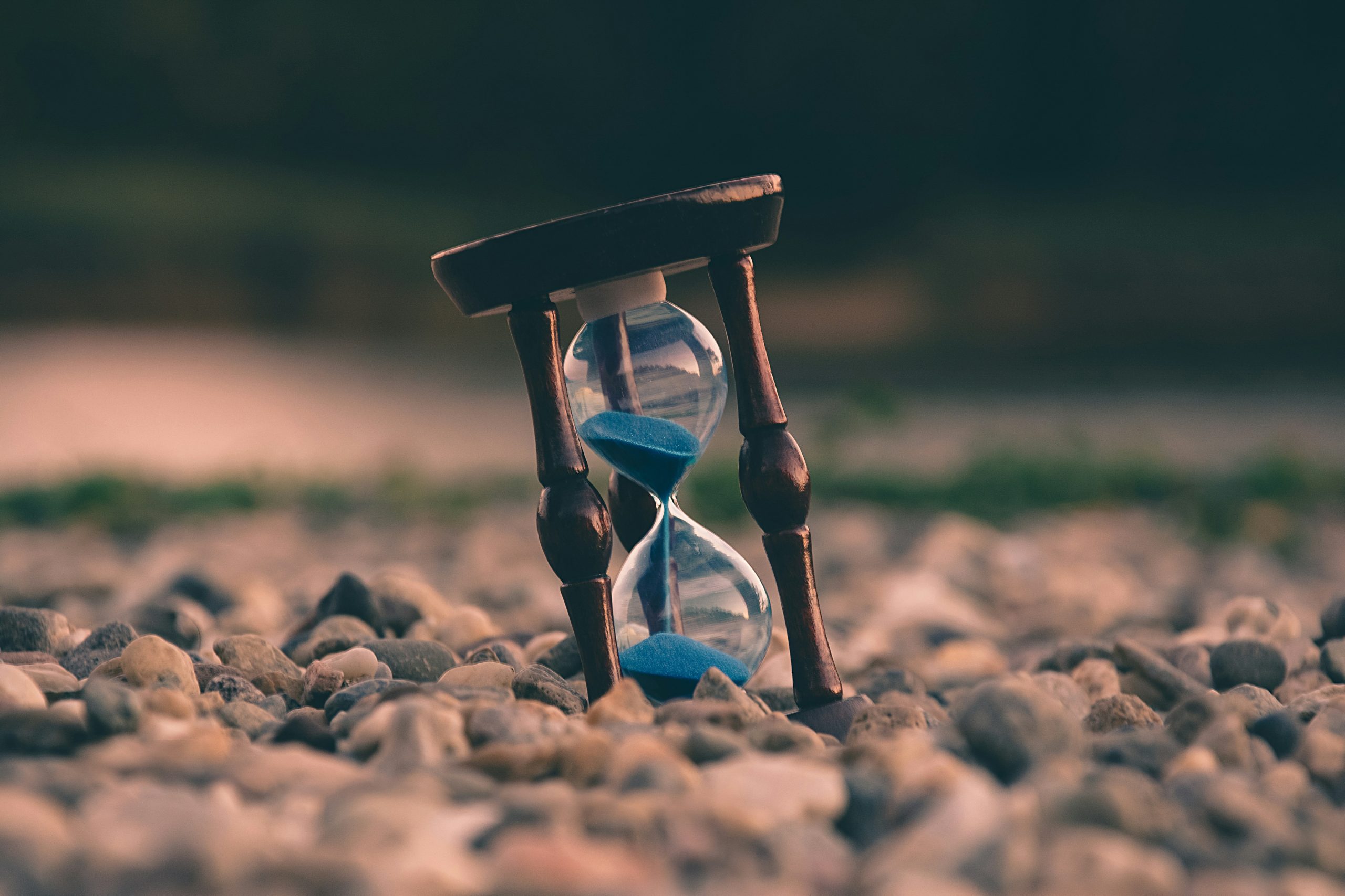hourglass timer on desk representing power hour productivity session