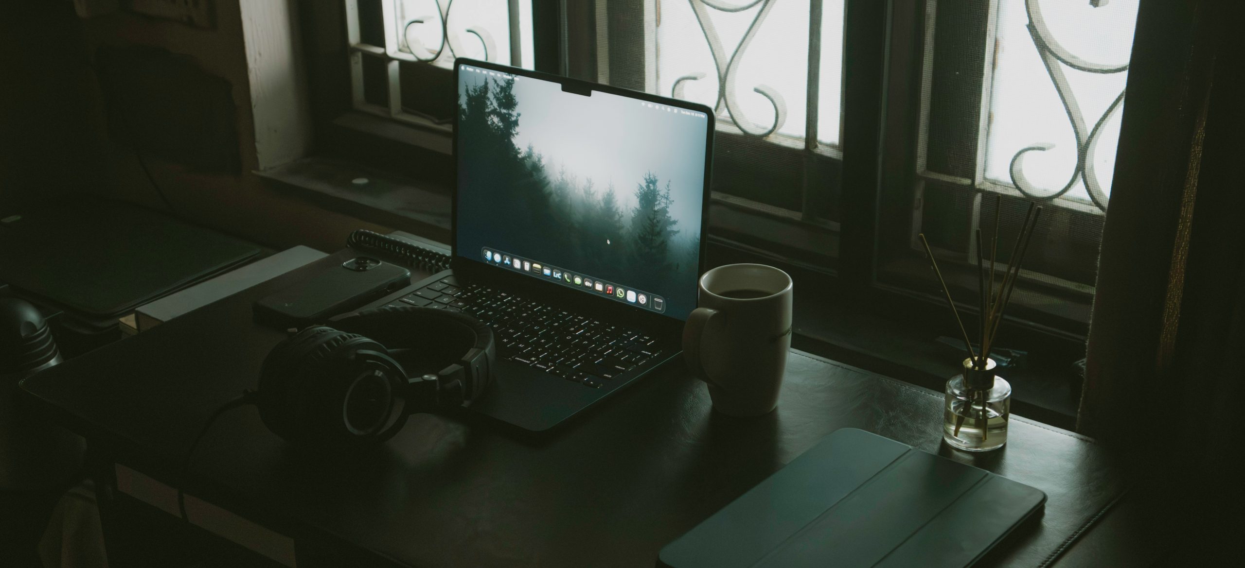 laptop and headphones by window for a focused todoist review 2026 workflow