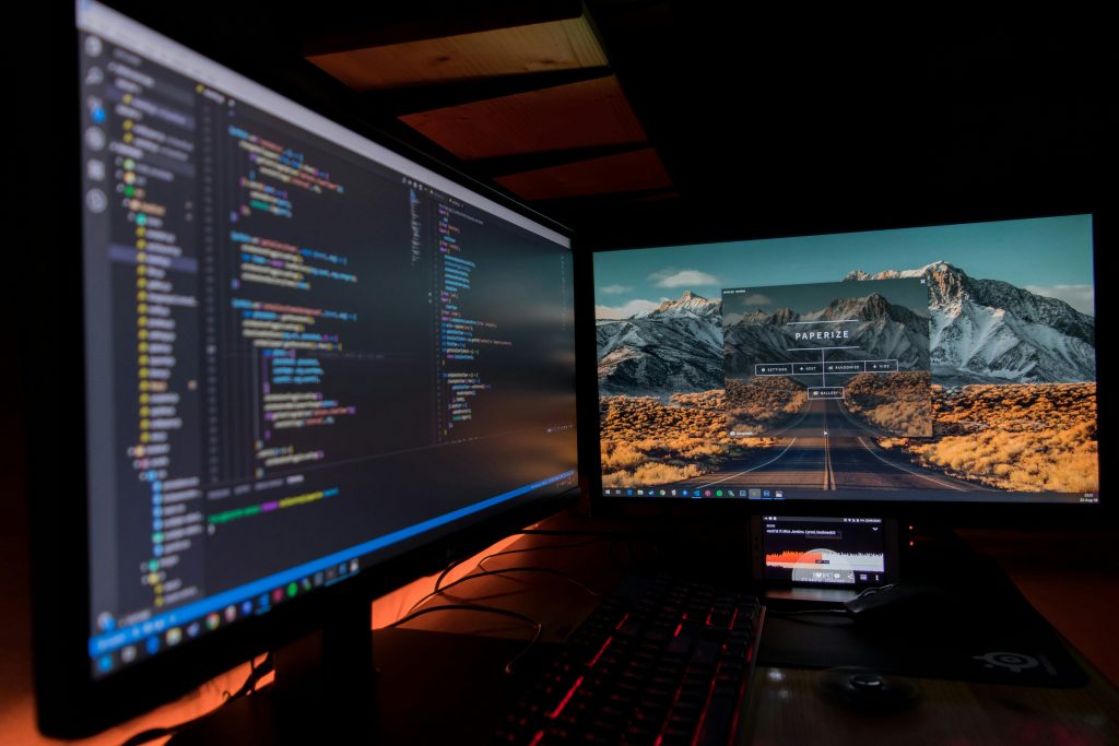AI agent overload across a dual-monitor remote work desk