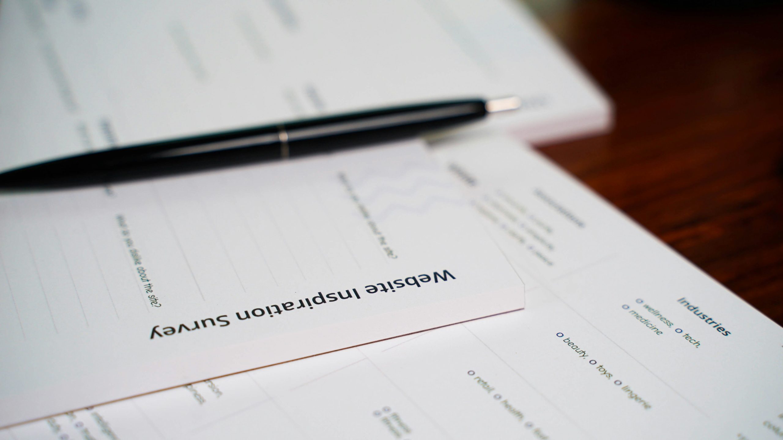 pen and paper for an AI tool audit checklist to cut AI agent overload