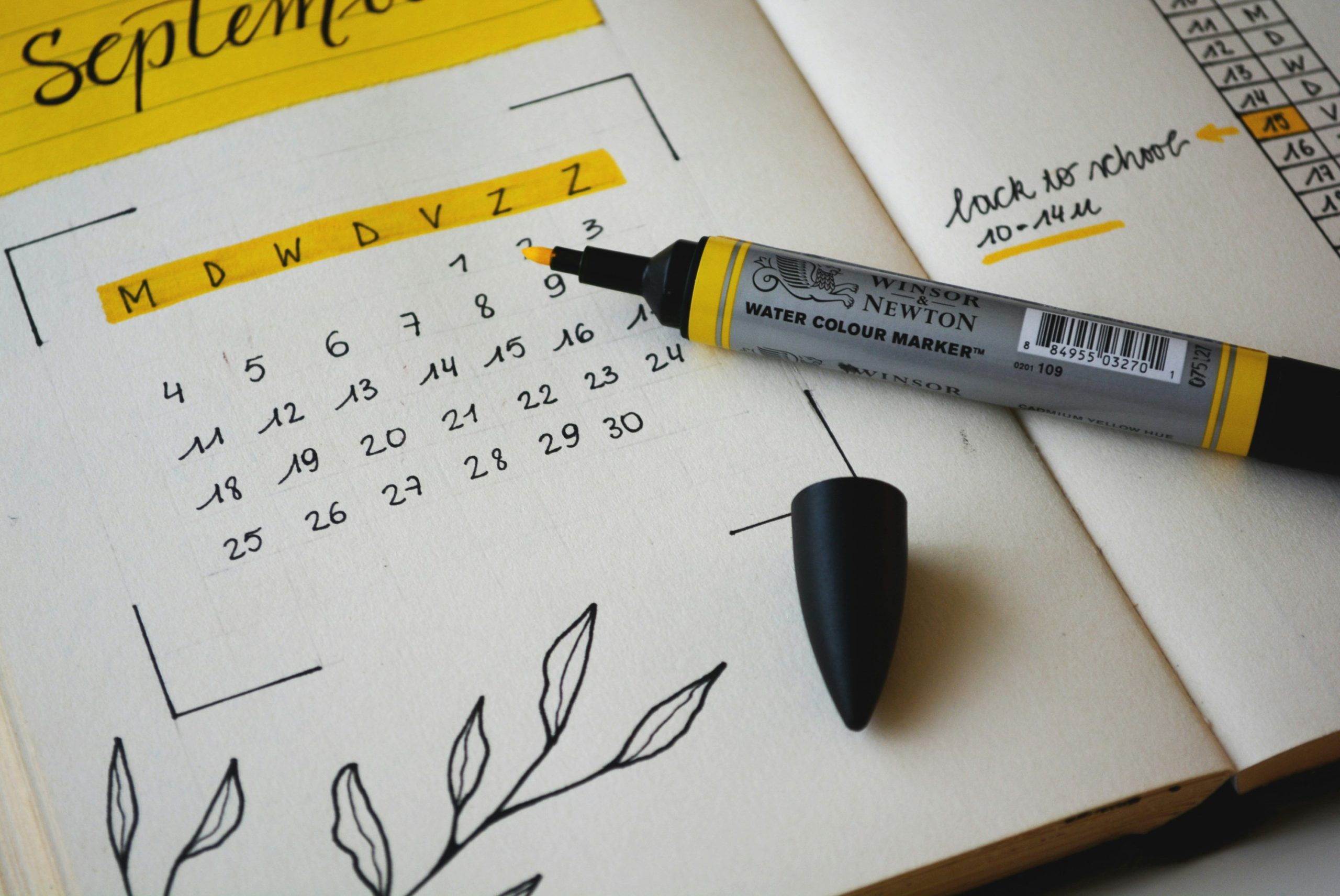 black marker on notebook for async collaboration notes