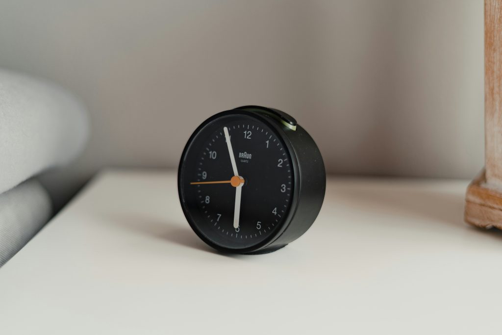 deep work schedule analog clock on desk