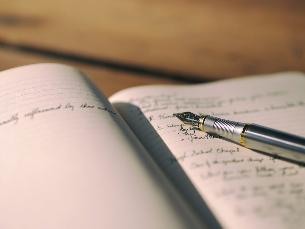 journaling for productivity in an open notebook with fountain pen