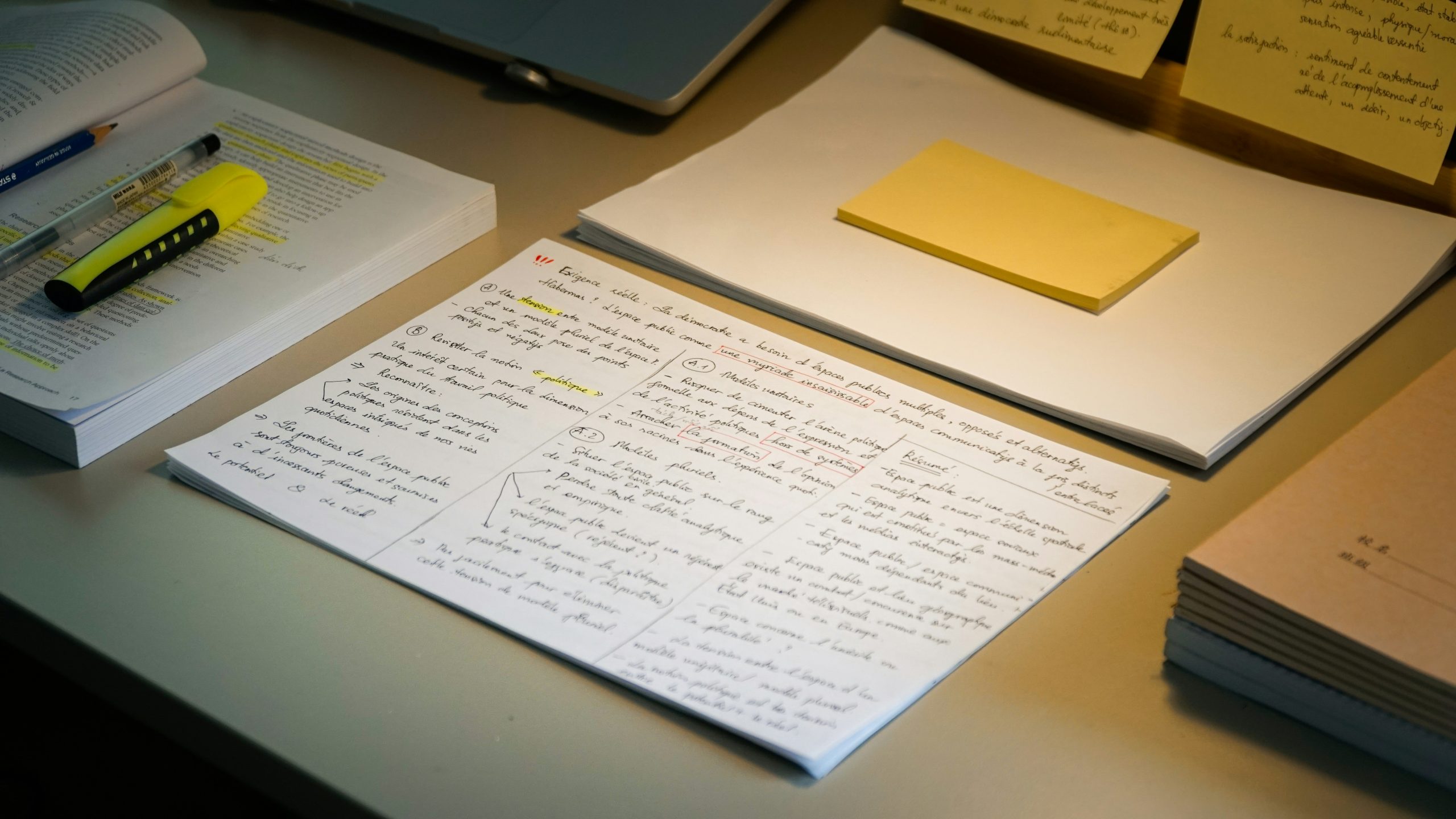 organized desk with papers and pen after setting a tighter work deadline