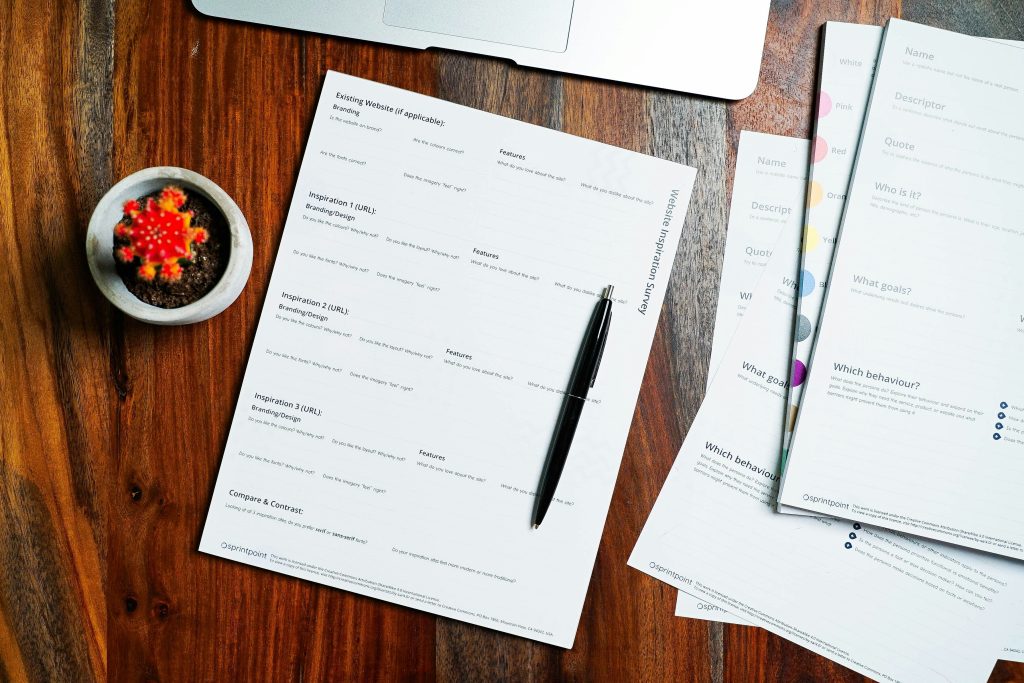 remote work trends 2026 data reports on a wooden desk
